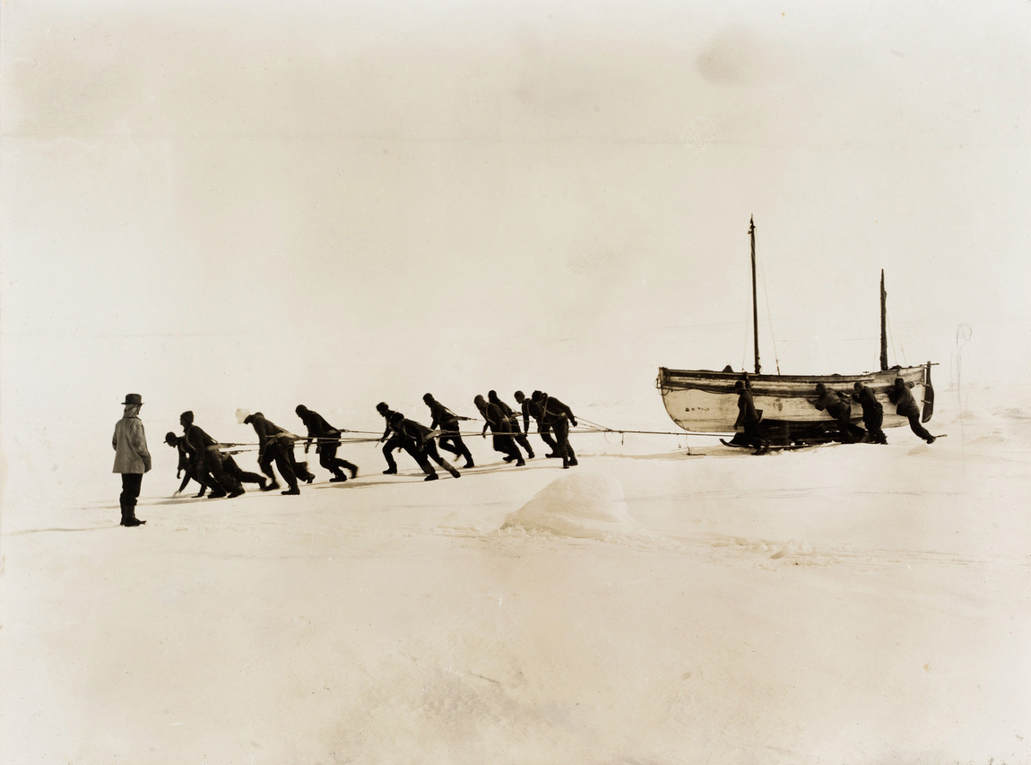 The crew pulling the James Caird across the ice