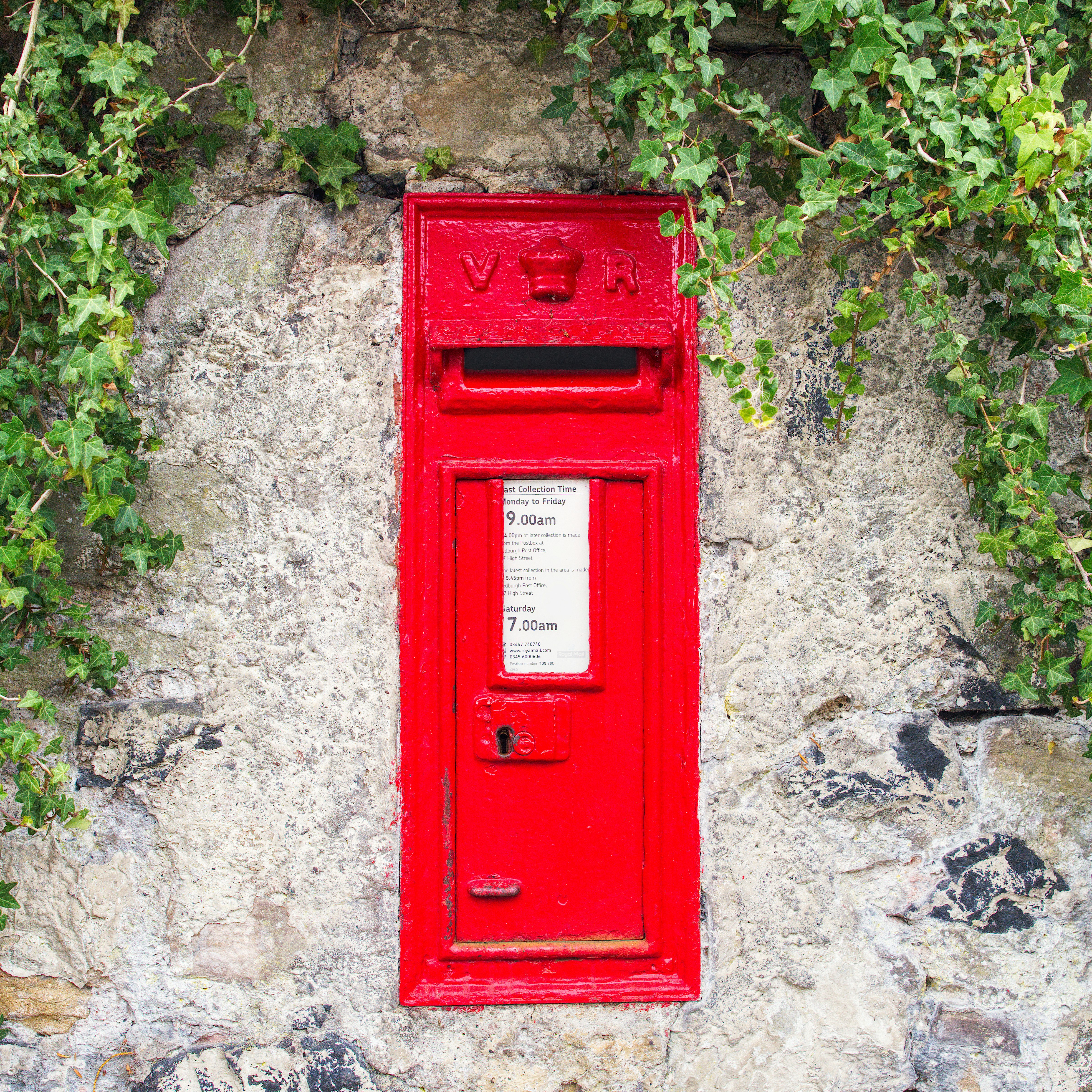 A post office box with a letter inside